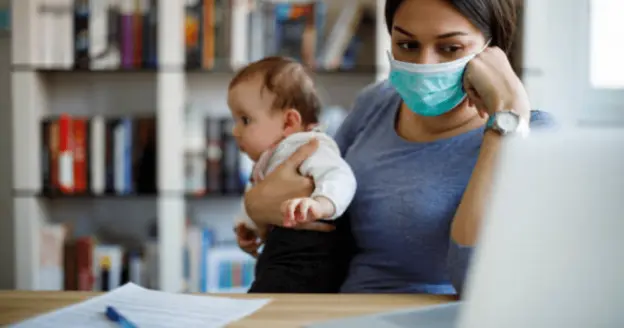 A mother holding her baby
