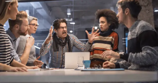 A man yelling at a group of people