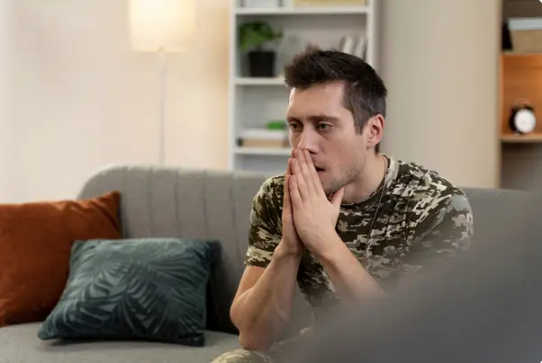 A man looking stressed and worried.